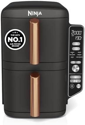 A front-facing view of the Ninja Double Stack XL Air Fryer SL400UKCP in black and copper, showcasing its slim vertical design on a kitchen worktop.